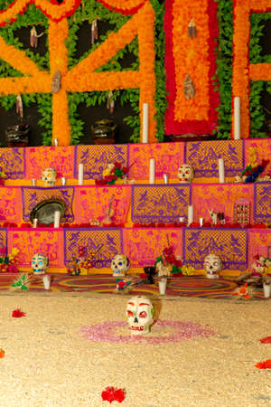 Traditional Mexican Day of the dead altar with sugar skulls and candlesの写真素材
