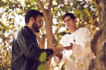 Priest comforting depressed man who tried to commit suicide.