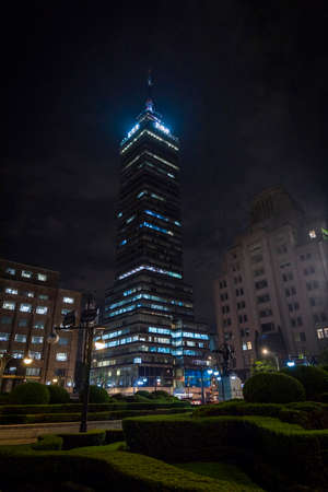 Night shot of the monument to Latin American Tower in Mexico City