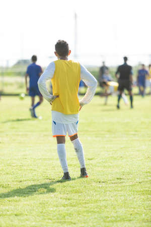 Real soccer player in full sport game.