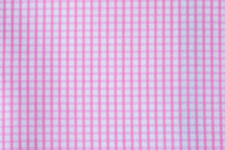 The texture of the tablecloth of pink pictures on the table in the snack.の写真素材