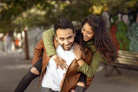 Couple in love. Enjoying happy in public parkの写真素材