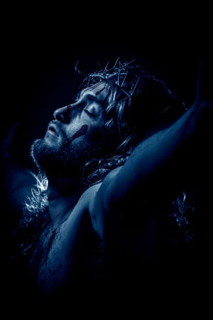 Jesus Christ crucified with crown of thorns during the passion