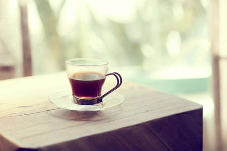 Detail of a coup of coffe on a table. blur backgroundの写真素材