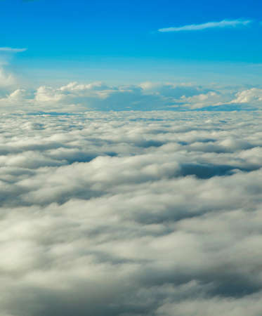 View of a sunrise full of color from the window of an airplane
