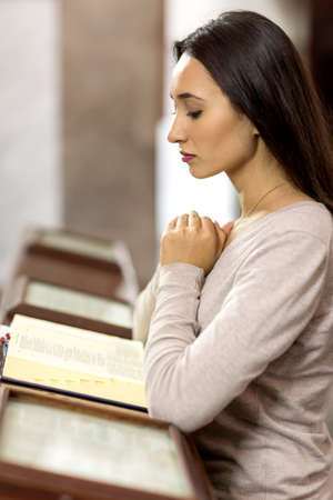 Young woman doing fasting and prayer in an interior