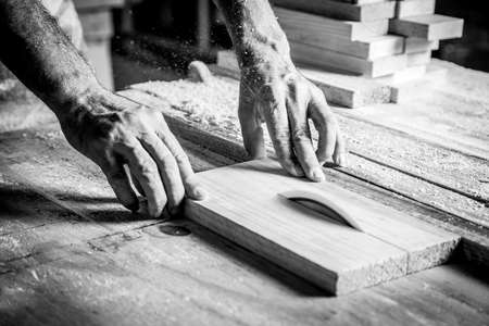 Man hands working in furniture wood industryの写真素材
