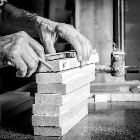 Man hands working in furniture wood industryの写真素材