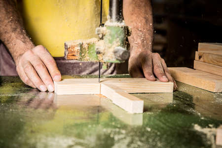 Man hands working in furniture wood industryの写真素材