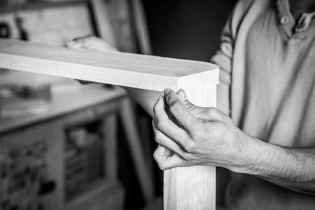 Man hands working in furniture wood industryの写真素材