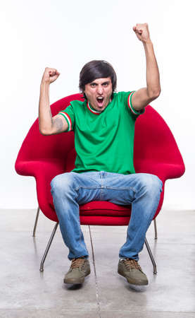 Young Man Shouting and feasting. Full of joy and excitementの写真素材