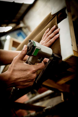Man hands working in furniture wood industry