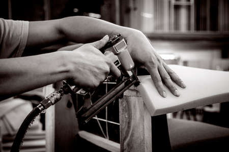 Man hands working in furniture wood industryの写真素材