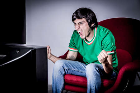 Young Man Shouting and feasting. Full of joy and excitementの写真素材