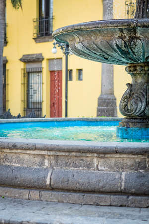 Beautiful old colonial fountain in a place outdoors.の写真素材