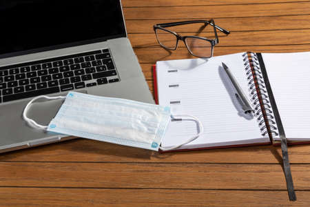 new normality. Day scene of a work at home with laptop after somebody leave from work place.の写真素材