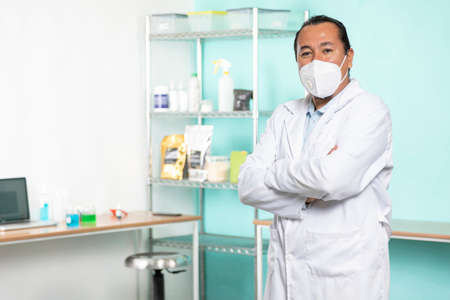 Proud enterprising man in his lab and looking at the camera. Interior detail.の写真素材