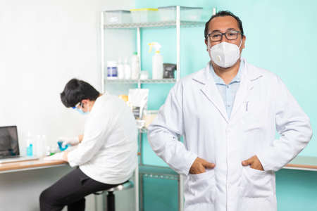 Proud enterprising man in his lab and looking at the camera. Interior detail.の写真素材