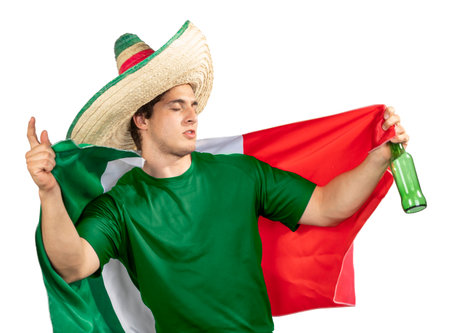 Young Mexican patriot with ranger hat and Mexican flag celebrating El Grito de Independencia with a beerの写真素材