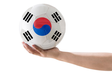 MAN'S HAND SOCCER BALL WITH Korea COUNTRY FLAG ON WHITE BACKGROUND.の写真素材