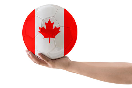 MAN'S HAND SOCCER BALL WITH CANADA COUNTRY FLAG ON WHITE BACKGROUND.の写真素材