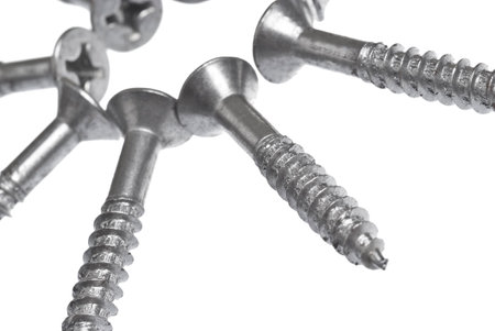 Close up of assorted nuts and bolts arranged in a circleの写真素材