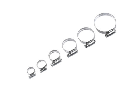 heap of metal clamps of different sizes for pipe on a white background arranged in different compositionsの写真素材