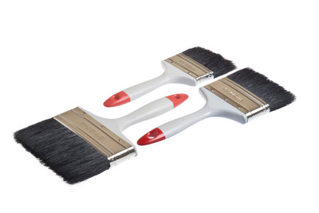 three brushes for painter of works and houses on a white backgroundの写真素材