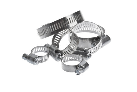 heap of metal clamps of different sizes for pipe on a white background arranged in different compositionsの写真素材