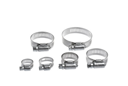 heap of metal clamps of different sizes for pipe on a white background arranged in different compositionsの写真素材