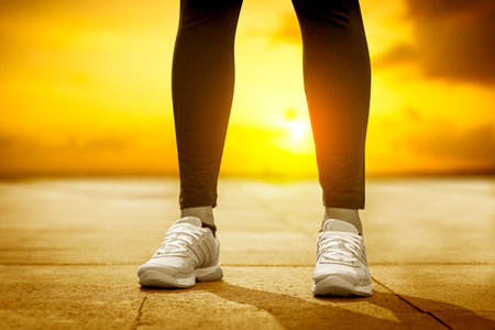 Runner feet running on road closeup on shoe. Woman fitness.の写真素材