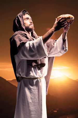 Jesus Christ praying to God in the dark black nightの写真素材
