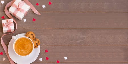 Wonderful morning on Valentine's day with cup of your favorite coffee and gifts from a loved one.の写真素材