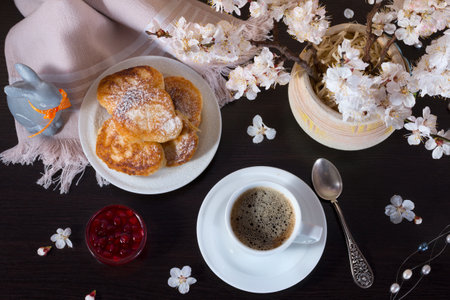 Good morning to your lovely woman. Tasty breakfast and gift. Pancakes with sweet jam and cup of hot coffee.の写真素材