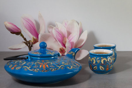 Japanese tea with a branch of magnolia. Asia culture. Antioxidant.の写真素材