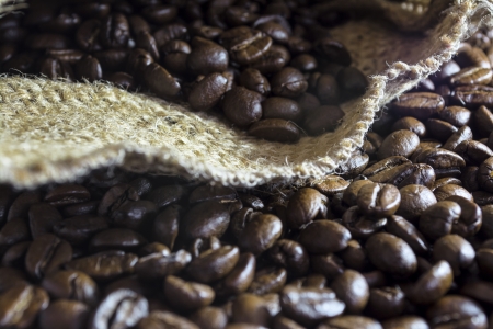Coffee beans inside his jute bag with side lightingの写真素材