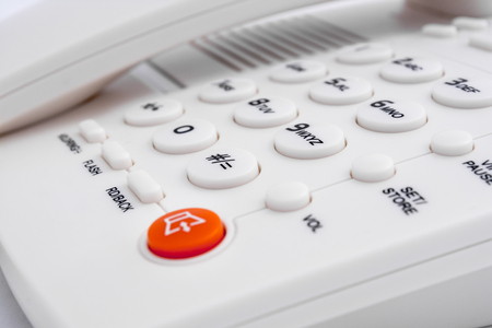 White Telephone With Red Button