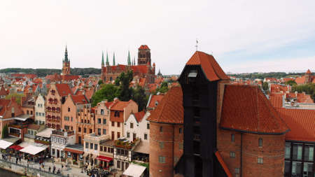 Gdansk, Poland 09.15.2019 Crane - Motlawa River - St Marys church behind. Aerial photo