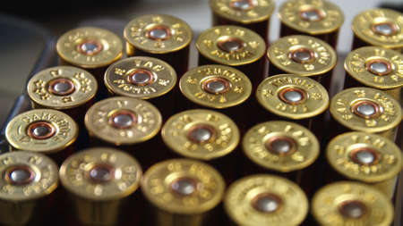 Shotgun cartridges Close-Up Shot of Shotgun Shells in Ammo Box.の写真素材
