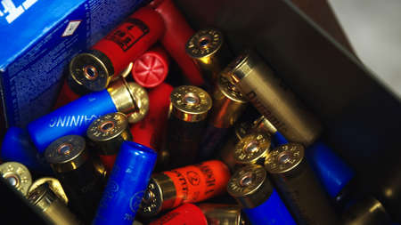 Ozarow Mazowiecki, Poland 10.20.2019 Shotgun on Table with shotgun cartridge shells in Box, shooting...