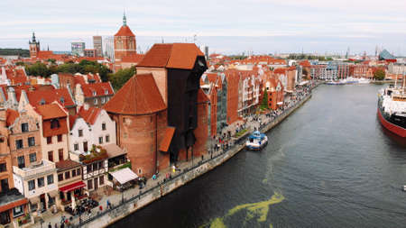 Gdansk, Poland 09.15.2019 Crane - Motlawa River - historic medieval building. Aerial photo