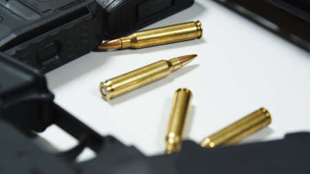 Two rifles with colimator laying on the table in shooting range. High quality photo
