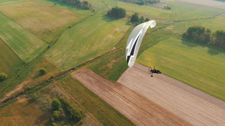 Paramotor Tandem Gliding And Flying In The Air. Copy space. High quality photo