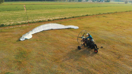Paramotor gliding tandem preparing to take off. High quality photo