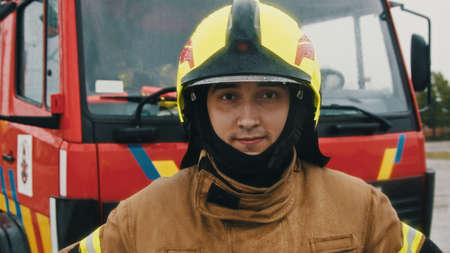 Portrait of the fireman in full uniform.