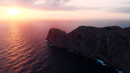 Lantern Cap de Formentor, pink colored sunrise over Lighthouse At Cape Formentor In Coast Of North Mallorca, Spain. . High quality photoの写真素材