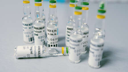 Warsaw, Poland 06.07.2019 - Close up of many vials of adrenaline on top of a medical table. High quality photoのeditorial素材