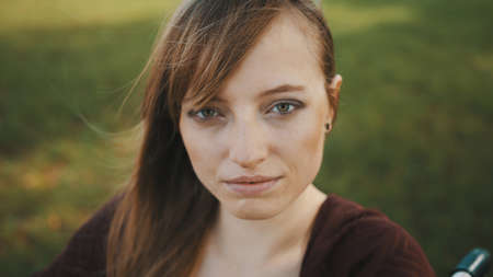Portrait of beautiful young caucasian paralyzed woman in wheelchair. High quality photo