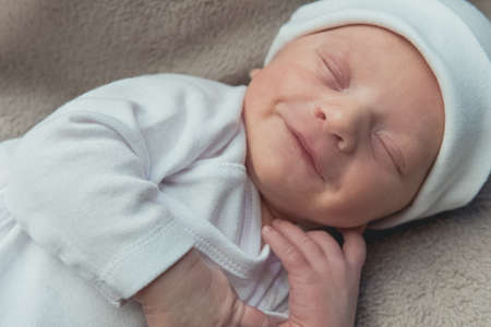 cute newborn baby sleeping peacefully on the blanket. High quality photoの写真素材