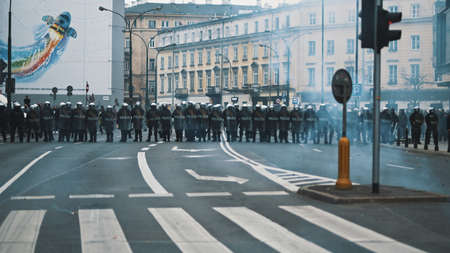 Warsaw, Poland 11.11.2020 - Police guarding the streets on 102nd annyversary of polish independence day. High quality photoのeditorial素材